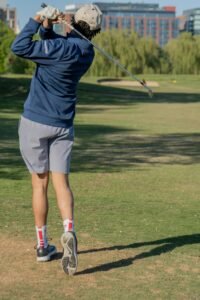 Golf enthusiast enjoying a game at a scenic course in Washington, DC under bright conditions.