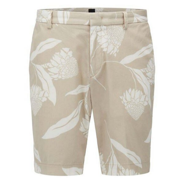 Male golfer wearing geometric print shorts on a sunny resort course.